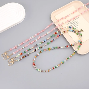 Crossbody phone strap set with natural stone beads and gold lobster clasps on grey background