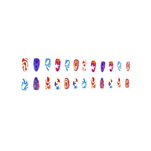Detail of almond press-on nails featuring colorful stars and embossed stripe patterns
