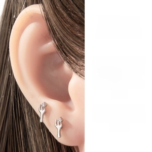 Macro view of sterling silver fork cartilage stud with sparkling cubic zirconia crystals