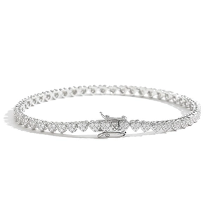 Silver-tone heart tennis bracelet featuring triple cubic zirconia stones and a box clasp