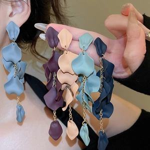 Detailed view of layered acrylic flower petal earrings with golden chains in five colors