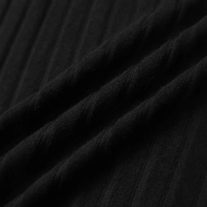 Macro shot of black ribbed knit fabric texture showing fine vertical fibers and elasticity