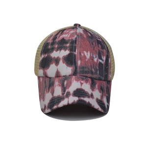 Detail of red and black tie-dye cotton front and breathable mesh back on baseball cap