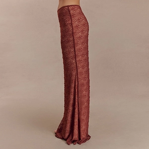 Detailed view of women's reddish-brown lace maxi skirt with textured floral patterns