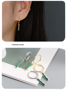 Close-up of S925 sterling silver emerald earrings and ear cuffs in gold and silver