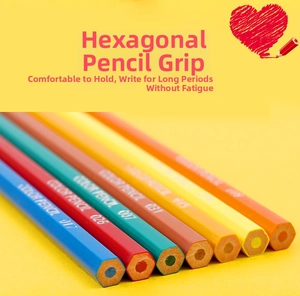 Close-up of hexagonal wood colored pencils in vibrant hues on yellow background