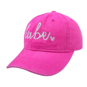 Detail of hot pink baseball cap with white babe embroidery and heart stitching