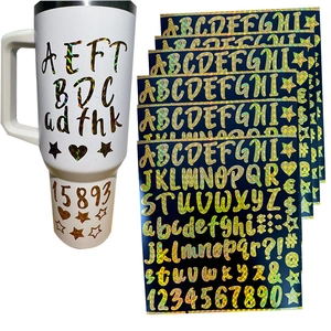 Holographic gold letter stickers applied on a water bottle with a sheet of DIY decals