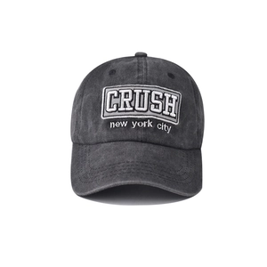 Close-up of the vintage washed fabric and large CRUSH embroidery on the baseball cap