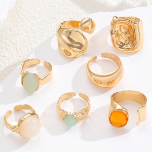 Detailed set of 7 gold adjustable rings with vintage hammered texture and colorful gemstones