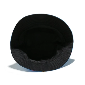 Detailed interior view of a bucket hat featuring black lining and colorful mushroom prints