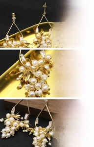 Détail de boucles d'oreilles plaquées or 18 carats avec des perles d'eau douce
