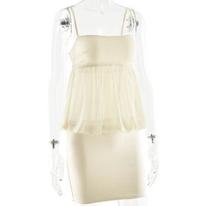 Detailed view of white chiffon two-piece set featuring a ruffled top and bodycon skirt