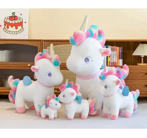 Set of five white unicorn plush toys with rainbow manes in various sizes for home decor