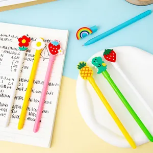 Cartoon gel pen set in macaron colors with cute silicone charms on bright background