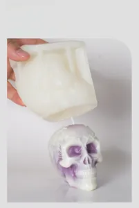 Detailed view of flexible silicone skull mold showing easy release of gradient candle