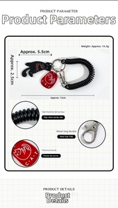 Detail view of acrylic black cat keychain with elastic spring cord and metal clasp
