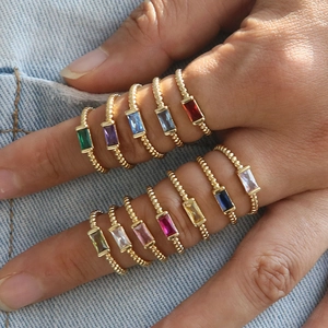 18k gold plated brass stacking rings featuring colorful rectangular birthstones on denim