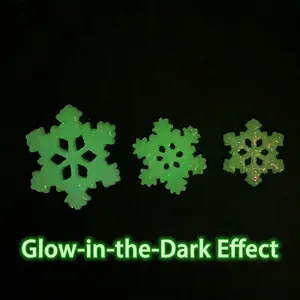 Luminous snowflake resin charms in three sizes with green glow and glitter finish