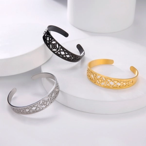 Set of three Celtic knot stainless steel open bangles in black, silver, and gold finish