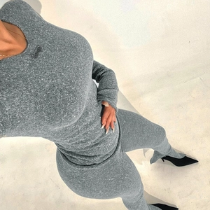 Women's minimalist dark grey knit two-piece set with long sleeve top and slit leggings
