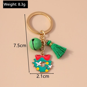 Detailed view of Christmas keychain with bell tassel and dimensions of 7.5cm and 8.3g