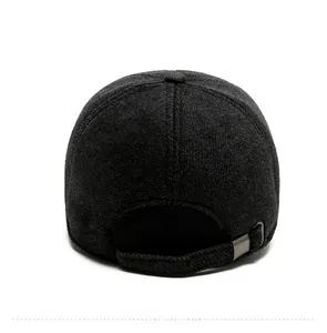 Detail view of adjustable metal buckle and dark grey wool blend texture on baseball cap