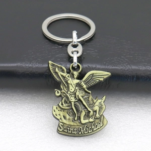 Macro shot of bronze Saint Michael keychain pendant with detailed metal engraving