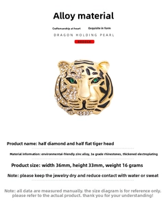 Detailed view of the rhinestone and enamel tiger head brooch in zinc alloy and gold plating