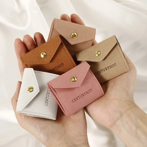 Portable microfiber jewelry pouches in various colors with metal snap closure and logo