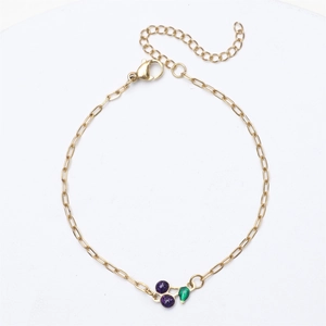 18K gold plated chain bracelet with purple glitter cherry charm on white background