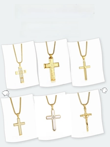 Detail of vacuum-plated titanium steel cross pendants with crystal inlays and polished finish