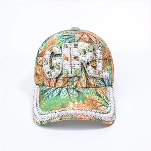 Detailed view of floral baseball cap with GIRL rhinestone letters and pearl brim trim