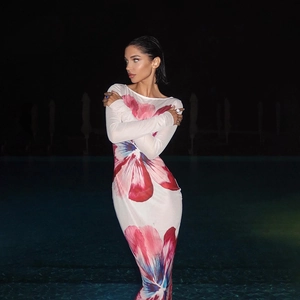 Detailed view of the red and blue floral mesh fabric on this slim-fit bodycon dress