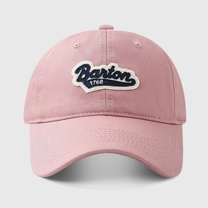 Close-up of pink cotton baseball cap with Barton 1768 vintage embroidery patch