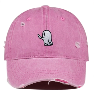Detail of cute ghost embroidery on a pink distressed washed denim baseball cap for street style