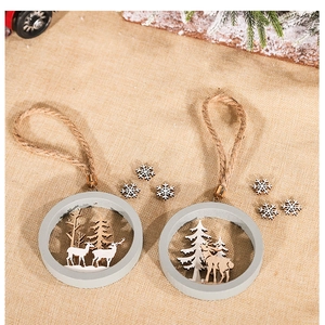 Detail of wooden 3D reindeer Christmas ornaments with natural hemp rope on rustic burlap
