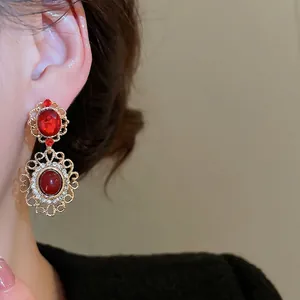Elegant vintage royal court style red ruby drop earrings with gold hollowed floral pattern