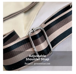 Detail view of adjustable woven shoulder strap in black and beige for crossbody bags