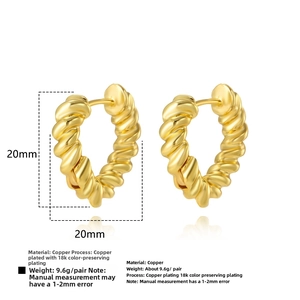 Detailed view of 20mm gold twist hoop earrings with textured 18k plated rope finish