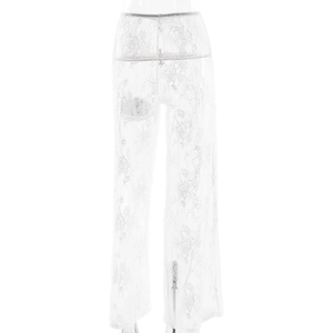 Close-up of white sheer lace fabric details on high-waisted wide-leg trousers