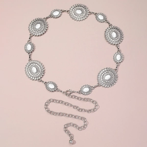 Silver bohemian daisy chain belt with turquoise marble stones on a pink background