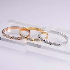 Three-piece set of nail bangle bracelets with rhinestones in gold, silver, and rose gold
