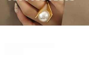 Macro view of unique golden geometric frame and large white pearl detail on a statement ring