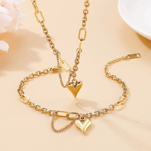 Elegant gold heart pendant necklace and bracelet set made of durable stainless steel