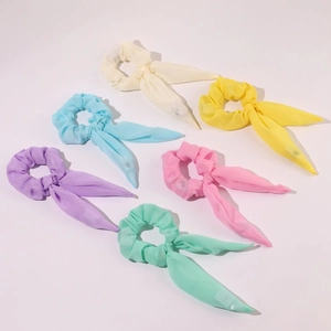 Set of six colorful LED glowing chiffon hair scrunchies with long ribbons in soft pastel tones