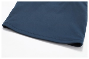 Detailed close-up of navy blue fitness top hem featuring professional twin-needle stitching