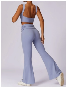 Rear view of lavender yoga set showing U-shaped back sports bra and flared leggings