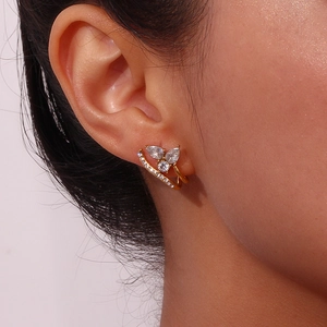 Close-up of gold chunky C-shape hoop earrings with water drop zircon butterfly design