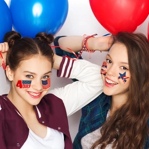 Models wearing 4th of July face stickers with American flag and patriotic star designs